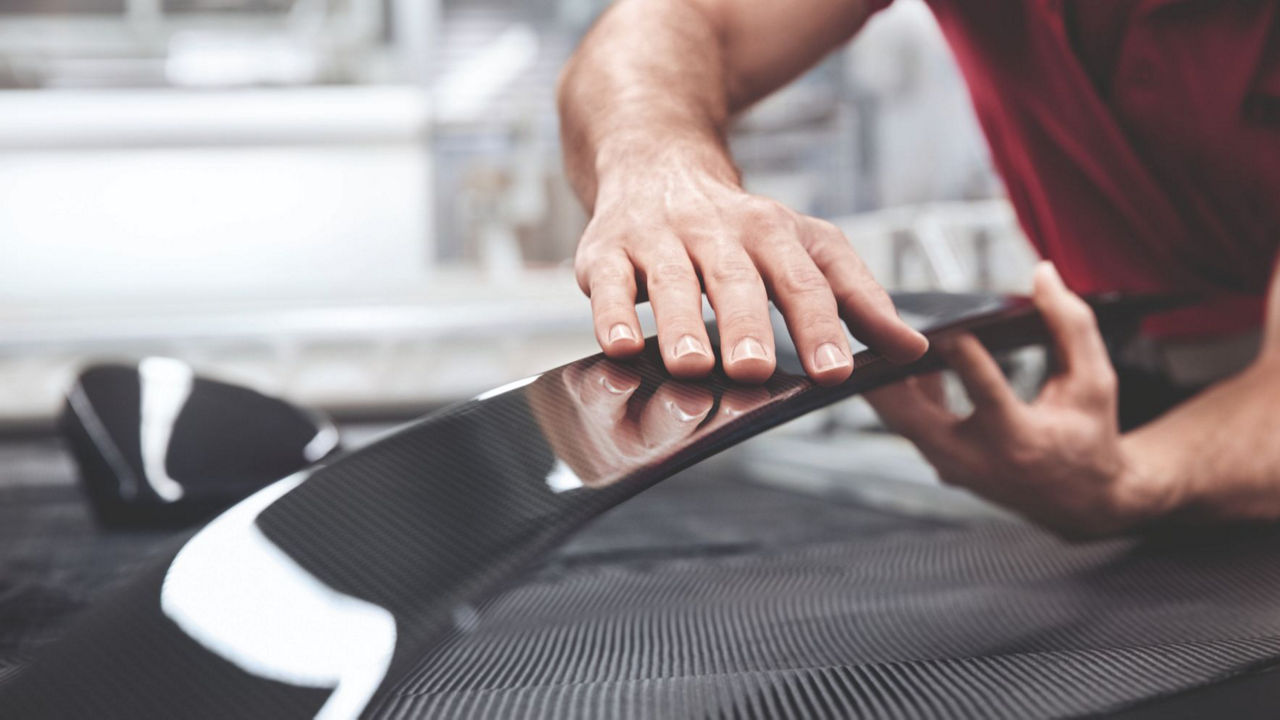 Hand brushing over car body panels.